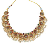Gold necklace with gemstones and pearls on a white background