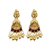 Pair of gold earrings with red and white stones on a white background