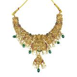Gold necklace with green and red stones on a white background