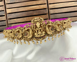 Gold jewelry with purple cushion on a white fabric background