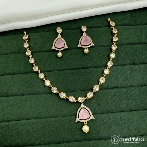 Jewelry set with necklace and earrings on a green surface, brand 'Jewel Palace' visible.