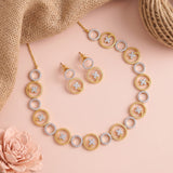 Gold and silver jewelry set featuring a necklace, earrings, and matching stud earrings, styled on a pink background with burlap and a rose.