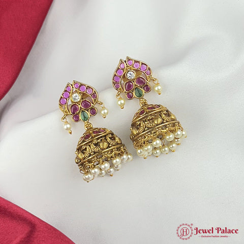 Ornate gold earrings with gemstones and pearls on a white background, featuring 'Jewel Palace' branding.