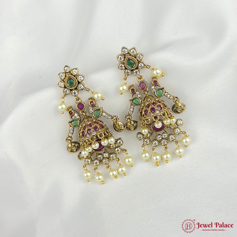 Ornate gold earrings with pearls and gemstones on a white background, branded 'Jewel Palace'.