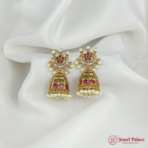 Gold earrings with pearls and gemstones on a white fabric background, featuring 'Jewel Palace' branding.