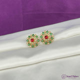 Gold earrings with green and red gemstones on a white and purple fabric background, featuring 'Jewel Palace' branding.