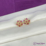 Gold and pink earrings on a white surface with a purple background, featuring the Jewel Palace logo.