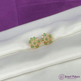 Gold and green earrings on a white fabric with a purple background, featuring the Jewel Palace logo.
