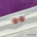 Pair of pink floral earrings with green centers on a white surface, branded 'Jewel Palace'.