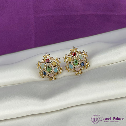 Decorative earrings with colorful gemstones on a white surface with a purple background, featuring the brand 'Jewel Palace'.