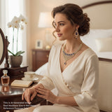 Woman in a white dress with jewelry sitting in a bedroom