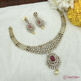 Jewelry set with necklace and earrings on a white fabric background