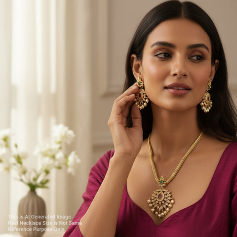 Woman wearing gold jewelry with a blurred background