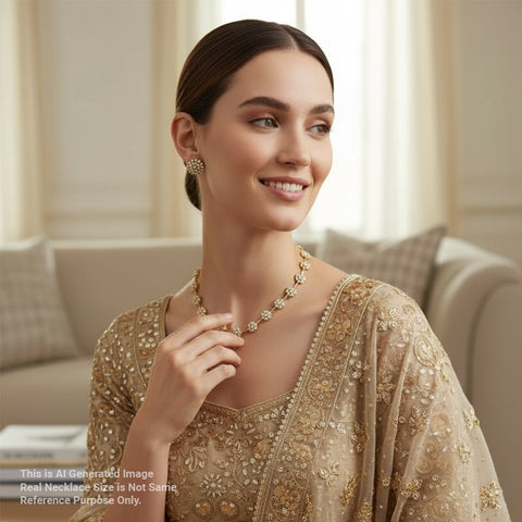 Woman wearing a gold necklace and earrings in a living room setting