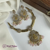 Gold and pink jewelry set on a white fabric with 'Jewel Palace' branding.