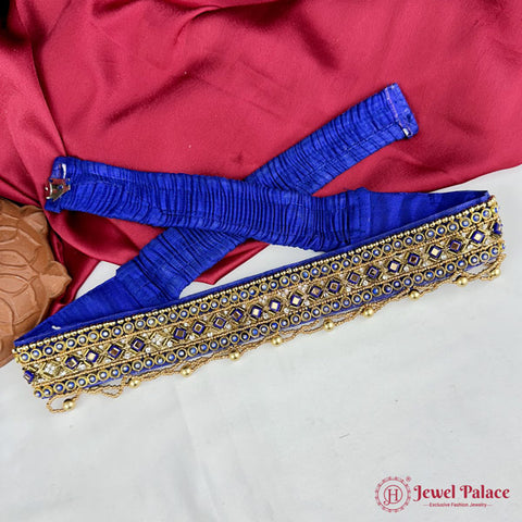 Decorative blue and gold belt on a red fabric background with 'Jewel Palace' branding.