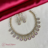 Necklace and earrings set with pink stones on a satin fabric background, featuring 'Jewel Palace' brand.