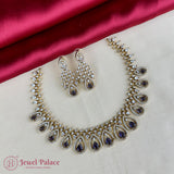 Jewelry set with necklace and earrings on a satin surface, featuring 'Jewel Palace' brand.