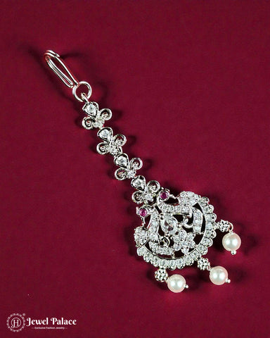 Decorative keychain with intricate design and pearls on a red background, featuring 'Jewel Palace' branding.