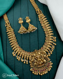 Gold necklace and earrings on a green fabric background with 'Jewel Palace' branding.