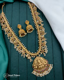 Gold necklace and earrings on a green fabric background with 'Jewel Palace' branding.
