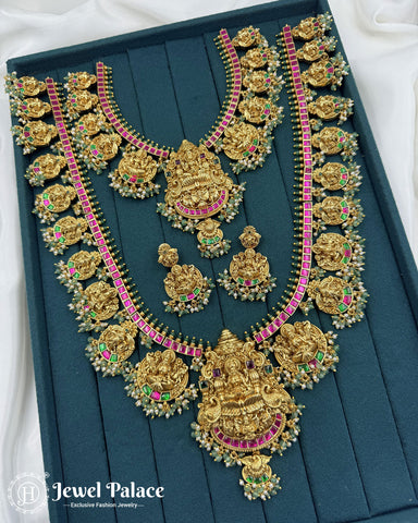 Ornate gold necklace with green and red stones on a teal background, brand 'Jewel Palace' visible.