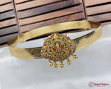 Gold headband with intricate design and colorful stones on a white background