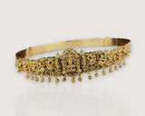 Gold belt with intricate designs and small beads on a light background