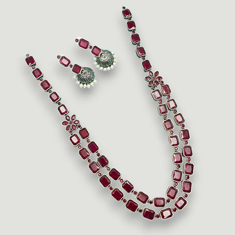 Jewelry set with necklace and earrings on a white background