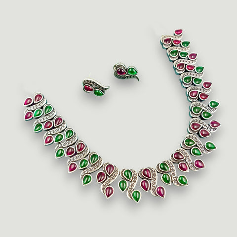 Jewelry set with necklace and earrings on a white background