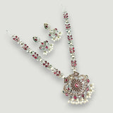 Jewelry set with necklace, earrings, and bracelet on a light gray background