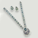 Jewelry set with necklace and earrings on a light gray background