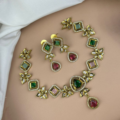Ornate necklace with gemstones on a plain background