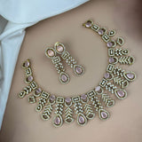 Ornate necklace and earrings on a person's shoulder