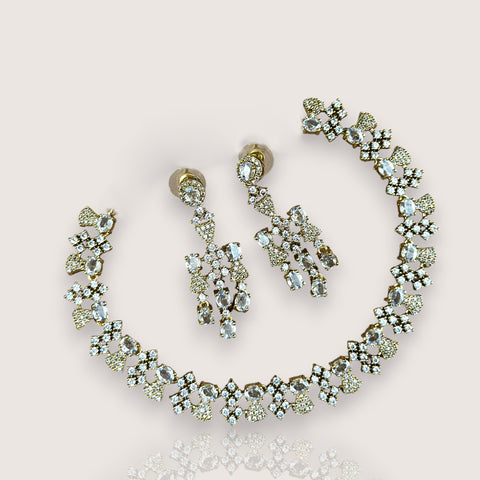 Jewelry set with necklace and earrings on a light pink background