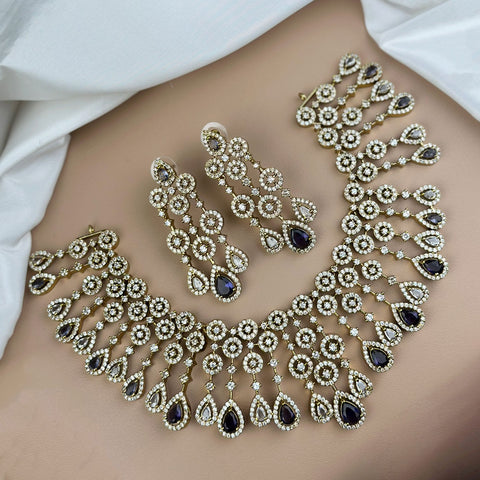 Ornate necklace and earrings on a model with a white background