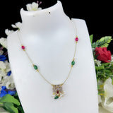 Necklace with gemstones on a white mannequin bust against a floral background