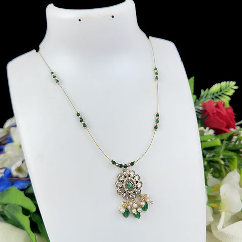 Jewelry necklace with green beads and pendant on a white mannequin bust with floral background