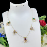 Delicate necklace on a mannequin bust with flowers in the background
