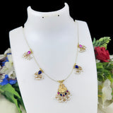 Gold necklace with colorful gemstones on a white mannequin bust against a floral background