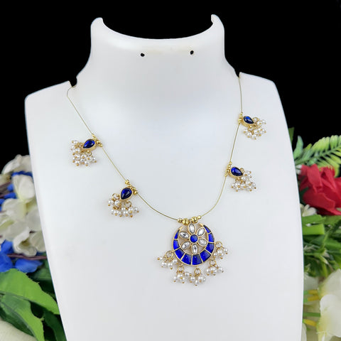 Jewelry set with necklace and earrings on a mannequin bust against a floral background