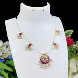 Jewelry set with necklace and earrings on a mannequin bust with flowers in the background