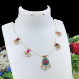 Decorative necklace on a mannequin with a floral background