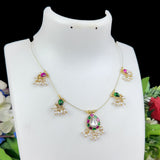 Decorative necklace with gemstones on a mannequin bust against a floral background