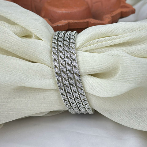 Silver chain bracelet on a white fabric background