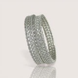 Silver hoop earrings on a light gray background