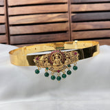 Gold headband with decorative elements on a white surface