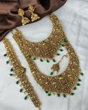 Gold jewelry set with necklace, earrings, and other accessories on a white background