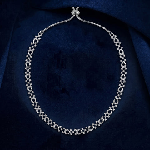 Shine with effortless elegance in this Trendy American Diamond Necklace, designed especially for teenage girls and young women who love modern, minimal jewelry. Crafted with a premium silver-plated finish and sparkling American Diamond (CZ) stones, this necklace features a delicate floral-inspired pattern that adds just the right amount of sparkle to your everyday style.
