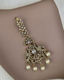 Gold bracelet with pearls on a skin background